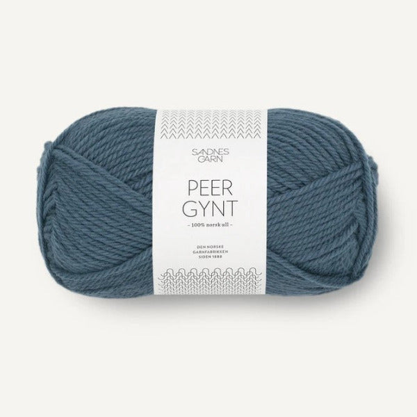Blue ball of yarn with a label on a white background