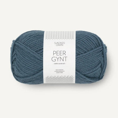 Blue ball of yarn with a label on a white background