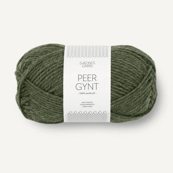 Ball of green yarn with a label on a white background