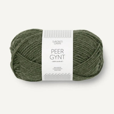 Ball of green yarn with a label on a white background