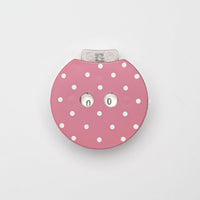 Pink polka dot row counter on a light gray background
