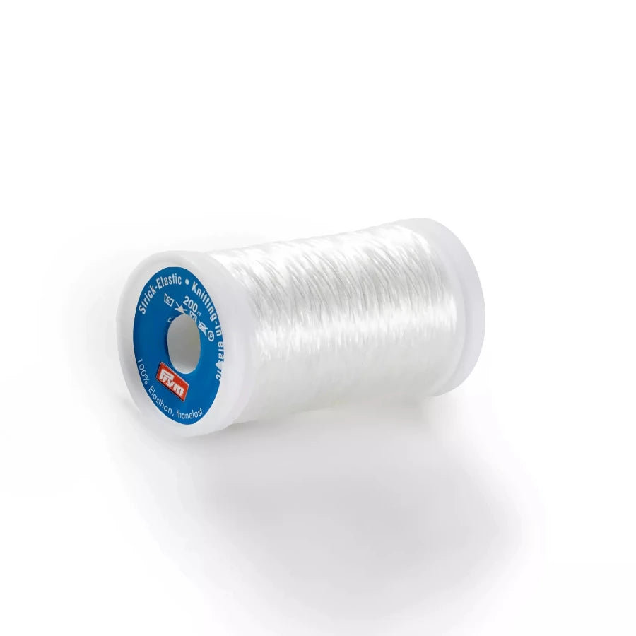 Spool of clear thread with a blue label on a white background