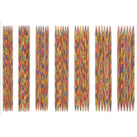 Set of colorful knitting needles on a white background