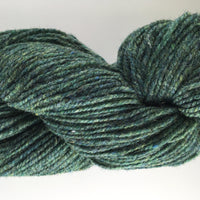 Green skein of yarn on a white background