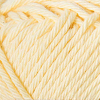 Close-up of a ball of pale yellow yarn