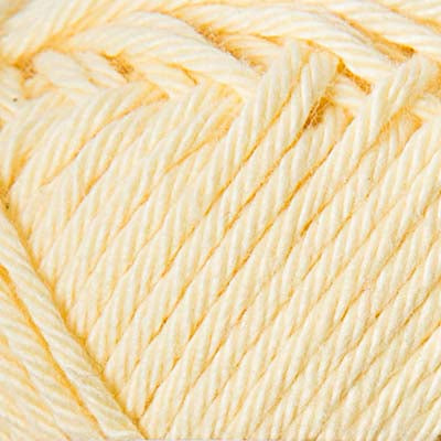 Close-up of a ball of pale yellow yarn