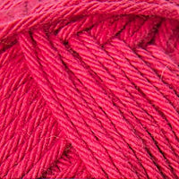 Close-up of a ball of bright pink yarn