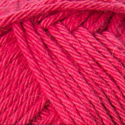 Close-up of a ball of bright pink yarn