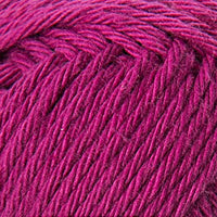 Close-up of a ball of fuchsia pink yarn