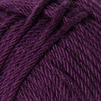 Close-up of a ball of burgundy purple yarn