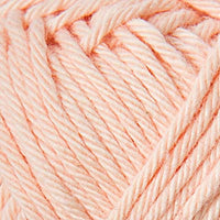 Close-up of pale peach yarn ball