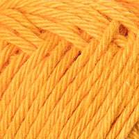 Close-up of a ball of orangey yellow yarn