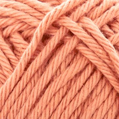 Close-up of pale peach pink yarn