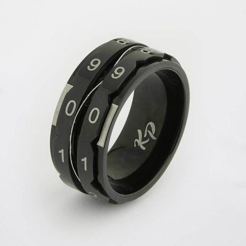Black metal finger ring with numbers on it, on a white background