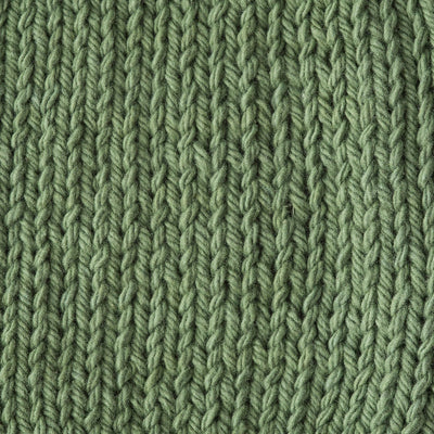 Close-up of sage green knitted fabric 