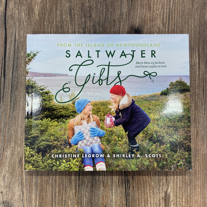 Book cover of 'Saltwater Gifts' by Christine Legrow and Shirley A. Scott on a wooden surface.