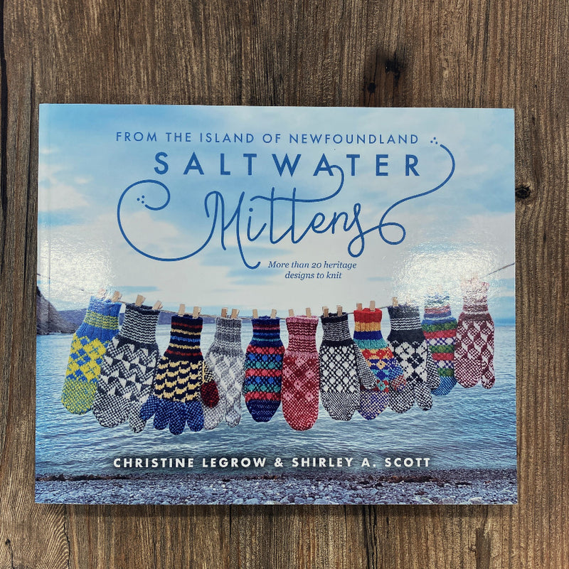 Cover of Saltwater Mittens book with a clothesline full of colourful mittens, on a wood background