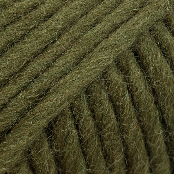 Close-up of a ball of olive green yarn
