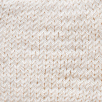 Close-up of cream knitted fabric 