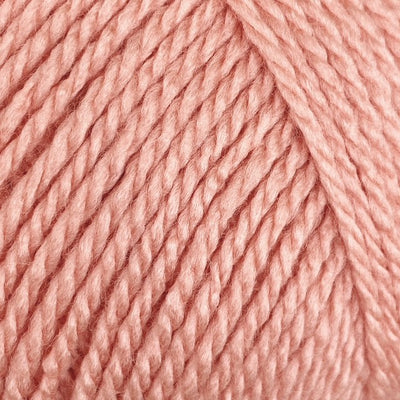 Close-up of peach coloured yarn 