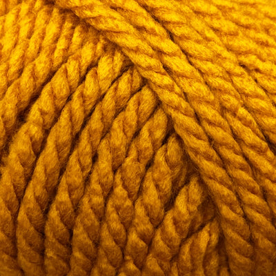 Close-up of a ball of dark yellow yarn