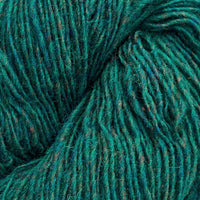 Close-up of a skein of green and blue heathered yarn