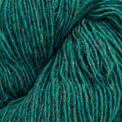 Close-up of a skein of green and blue heathered yarn