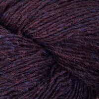 Close-up of a skein of dark burgundy and blue heathered yarn
