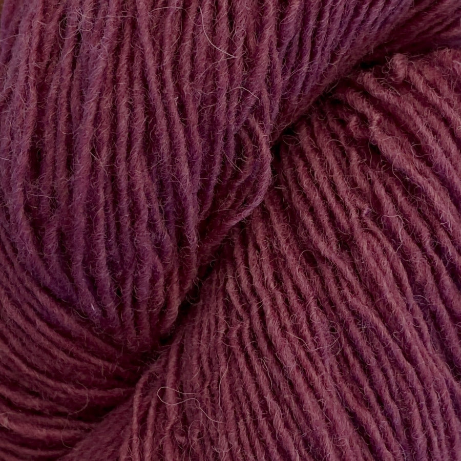 Close-up of a skein of antique rose coloured yarn