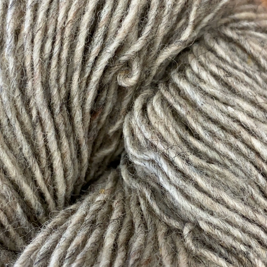 Close-up of a skein of oatmeal heathered yarn