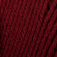 Close-up of a ball of dark red yarn 