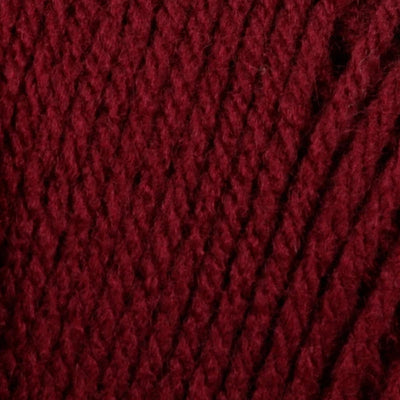 Close-up of a ball of dark red yarn 