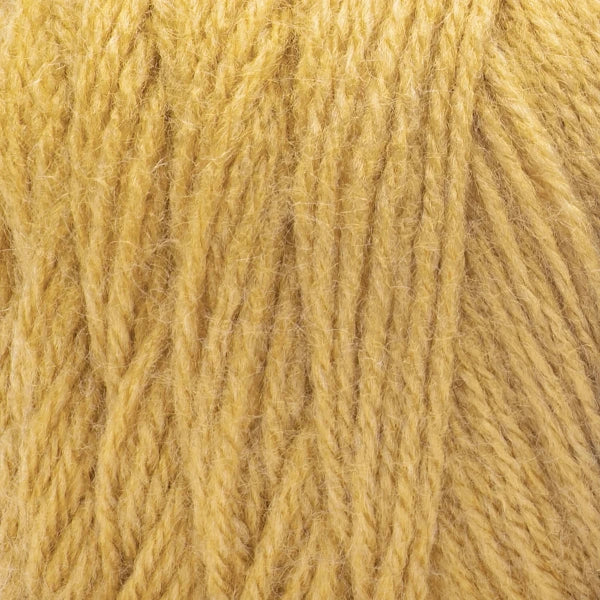 Close-up of a ball of light mustard yellow yarn