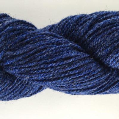 Close-up of blue yarn on a white background