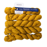 Yellow yarn skeins with a label on a white background