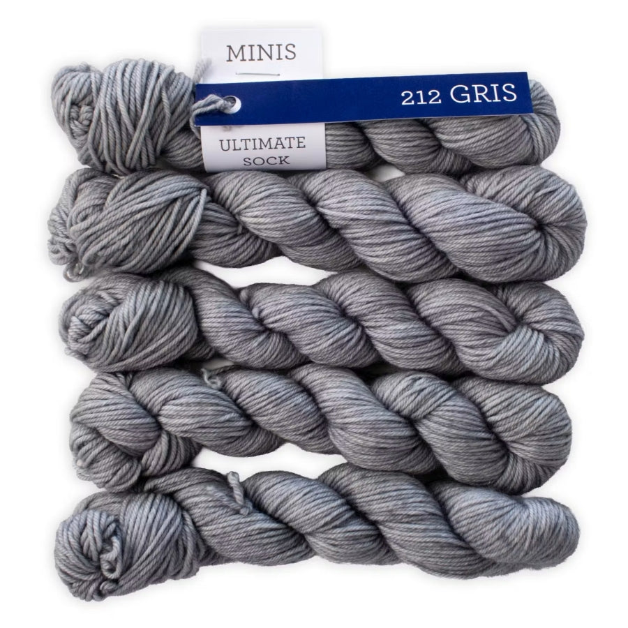 Gray yarn skeins with a label on a white background