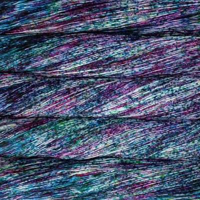 Close-up of multicolored yarn skeins in heavy blue and purple speckles