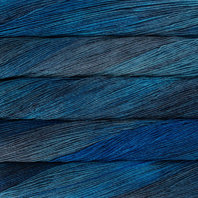 Close-up of yarn skeins in deep shades of blue