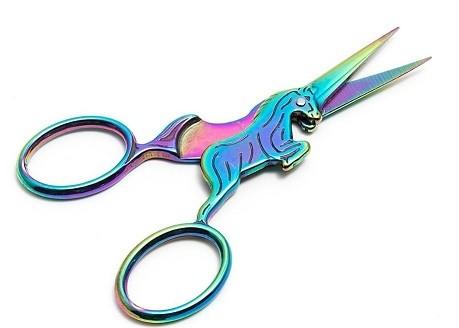 Colorful scissors with a unicorn design on a white background