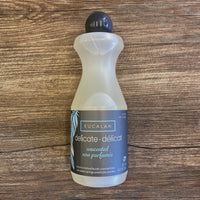 Bottle of Eucalan delicate detergent on a wooden surface
