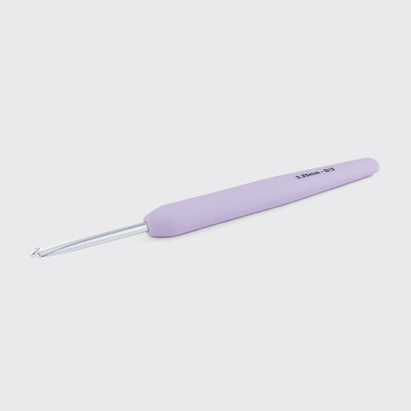 Pale purple crochet hook on a light gray background