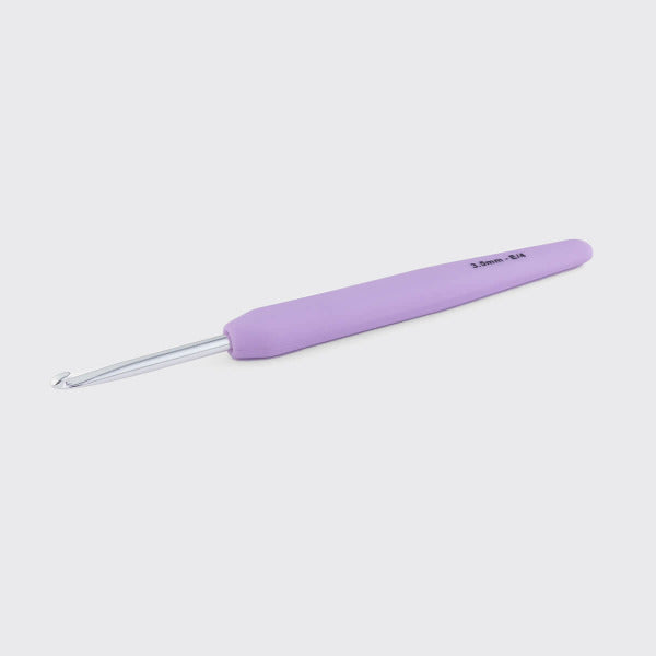 Light purple crochet hook on a white background