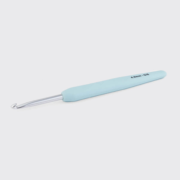 Light blue crochet hook on a white background