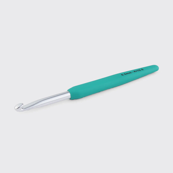 Aqua crochet hook on a white background