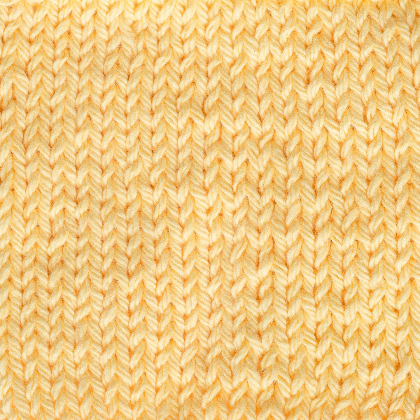 Close-up of a textured yellow fabric pattern