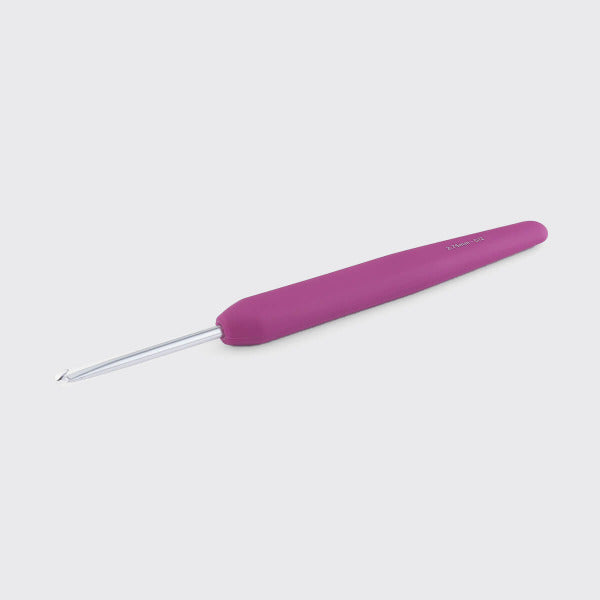 Purple crochet hook on a light gray background